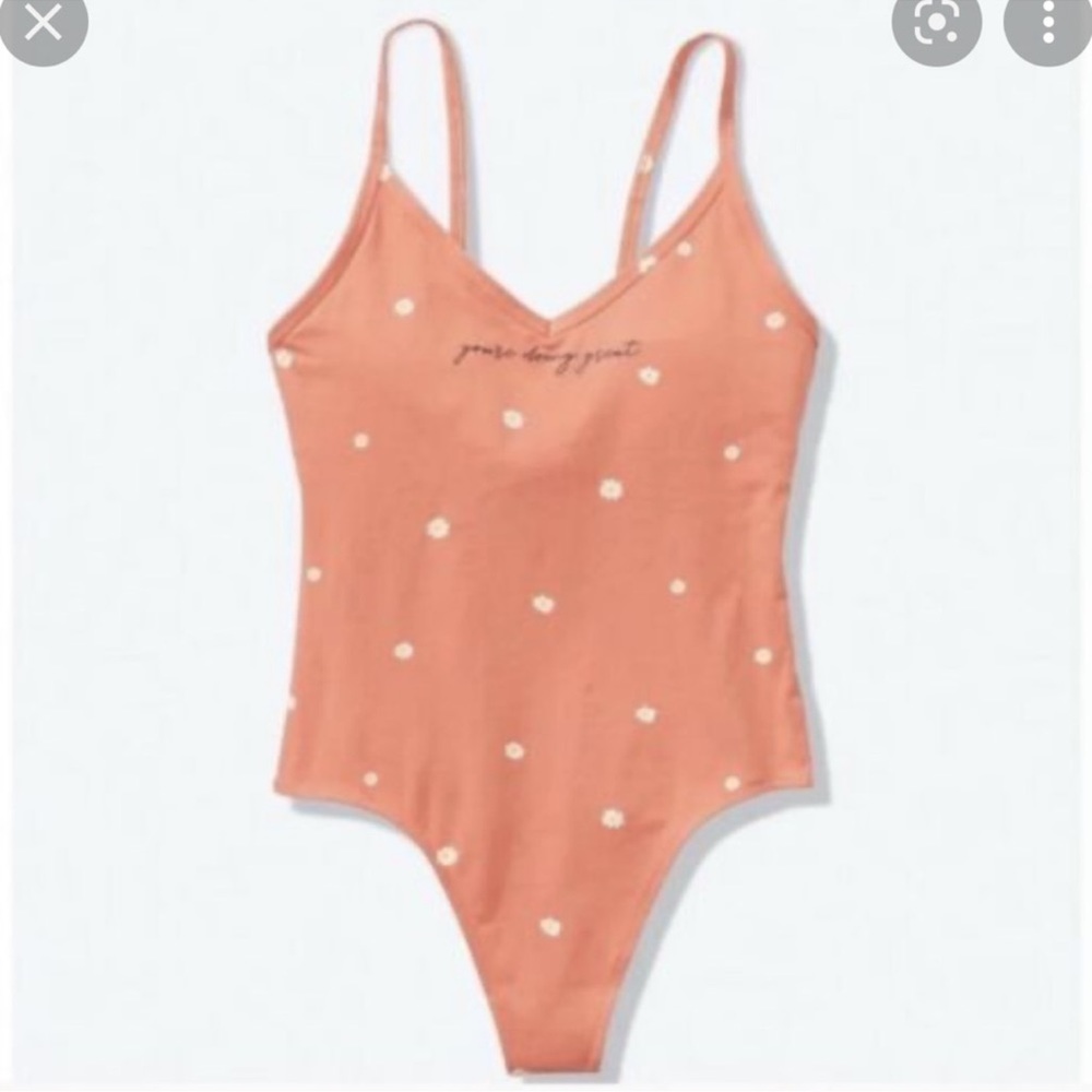 Pink VS You’re doing great bodysuit size large. Tried on but never worn.